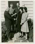 Typical American Family - Deal family receiving key and lease from Harvey Gibson