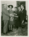 Typical American Family - Grant family receiving lease and key from Harvey Gibson