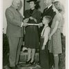 Typical American Family - Gran family receiving key and lease from Harvey Gibson