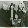 Typical American Family - Gran family children receiving signed baseball and charm bracelet from Harvey Gibson