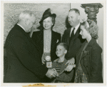 Typical American Family - Gran family children receiving signed baseball and charm bracelet from Harvey Gibson