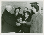 Typical American Family - Grant family children receiving signed baseball and charm bracelet from Harvey Gibson