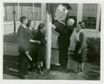 Typical American Family - Joslin family raising Vermont flag with Harvey Gibson