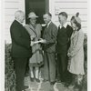 Typical American Family - King family receiving key and lease from Harvey Gibson