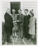 Typical American Family - King family receiving key and lease from Harvey Gibson