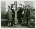 Typical American Family - King family raising Arkansas flag with Harvey Gibson