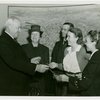 Typical American Family - Joslin family children receiving charm bracelets from Harvey Gibson