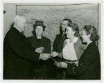 Typical American Family - Joslin family children receiving charm bracelets from Harvey Gibson