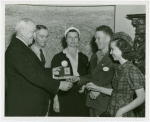 Typical American Family - King family children receiving signed baseball and charm bracelet from Harvey Gibson