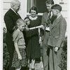 Typical American Family - Hearn family receiving key and lease from Harvey Gibson