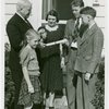 Typical American Family - Hearn family receiving key and lease from Harvey Gibson