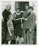 Typical American Family - Hearn family receiving key and lease from Harvey Gibson