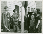 Typical American Family - Hearn family raising Connecticut flag with Harvey Gibson