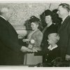 Typical American Family - Hansen family children receiving signed baseball and charm bracelet from Harvey Gibson