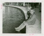 Typical American Family - Two Lewis family children dipping feet into fountain