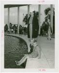 Typical American Family - Mrs. Lewis with two children dipping feet into fountain