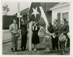 Typical American Family - Leathers family raising Texas flag with Harvey Gibson