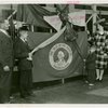 Typical American Family - Moushey family unwrapping ribbon at opening of Washington exhibit