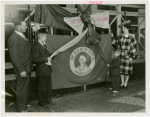 Typical American Family - Moushey family unwrapping ribbon at opening of Washington exhibit