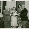 Typical American Family - Mullen family receiving keys and lease from Harvey Gibson