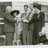 Typical American Family - Morris family receiving key and lease from Harvey Gibson