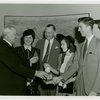 Typical American Family - Morris family children receiving signed baseball and charm bracelet from Harvey Gibson