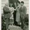 Typical American Family - Petersen family receiving lease and key from Harvey Gibson