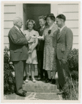 Typical American Family - Petersen family receiving lease and key from Harvey Gibson