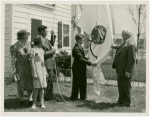 Typical American Family - Petersen family raising Minnesota flag with Harvey Gibson