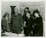 Typical American Family - Petersen family children receiving signed baseball and charm bracelet from Harvey Gibson