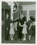 Typical American Family - Ogle family raising Tennessee flag with Harvey Gibson