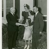 Typical American Family - Ogle family receiving key and lease from Harvey Gibson