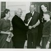 Typical American Family - Pumel family receiving key and lease from Harvey Gibson