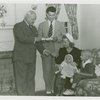 Typical American Family - Roberts family receiving key and lease from Harvey Gibson