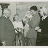 Typical American Family - Roberts family children receiving signed baseball and charm bracelet from Harvey Gibson