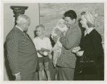 Typical American Family - Roberts family children receiving signed baseball and charm bracelet from Harvey Gibson