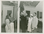 Typical American Family - Rorer family raising Virginia flag with Harvey Gibson