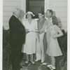 Typical American Family - Rorer family receiving key and lease from Harvey Gibson