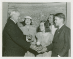 Typical American Family - Rorer family children receiving signed baseball and charm bracelet from Harvey Gibson