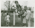 Typical American Family - Spitzna family raising Maryland flag with Harvey Gibson