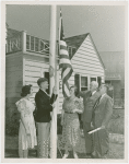Typical American Family - Spielman family raising American flag with Harvey Gibson