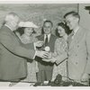 Typical American Family - Spielman family children receiving signed baseball and charm bracelet
