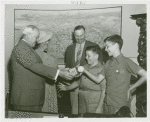 Typical American Family - Sanders family children receiving signed baseballs and charm bracelet