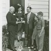 Typical American Family - Sparks family receiving key and lease from Harvey Gibson