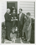 Typical American Family - Sparks family receiving key and lease from Harvey Gibson