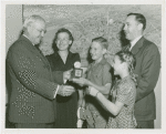 Typical American Family - Sparks family children receiving signed baseball and charm bracelet