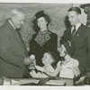 Typical American Family - Schaeffer family children receiving signed baseball and charm bracelet from Harvey Gibson