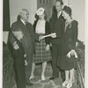 Typical American Family - Woods family receiving key and lease from Harvey Gibson