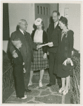 Typical American Family - Woods family receiving key and lease from Harvey Gibson