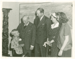 Typical American Family - Woods family receiving key and lease from Harvey Gibson